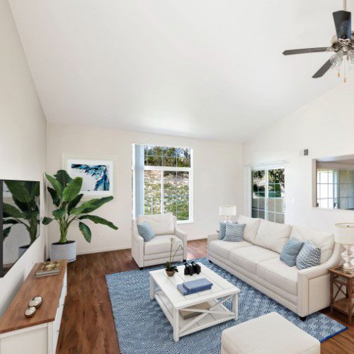 Beautiful Decorated Living Room With White Furniture And Wood Flooring